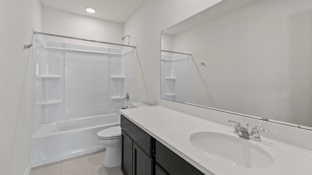 Representative furnished interior of a home built from the Southfork by Brightland Homes in Sunterra, Katy (Image 17).