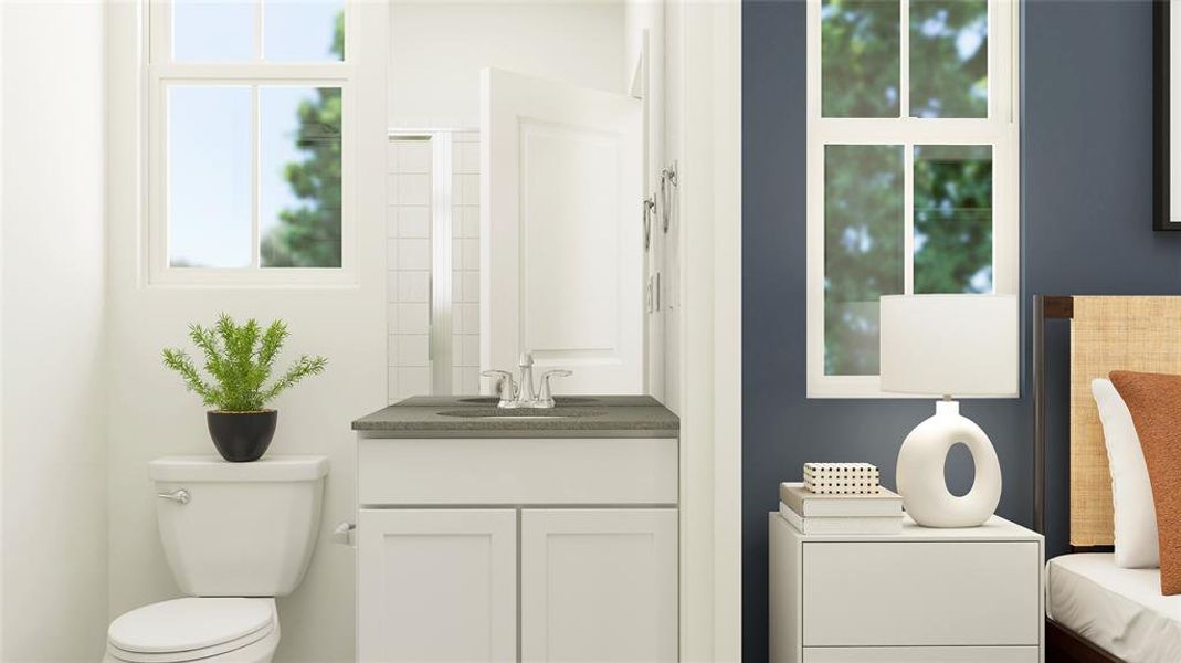 Bathroom featuring vanity and toilet