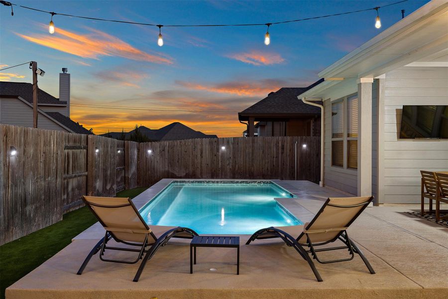 The poolside lounge area is set up for easy afternoons with plenty of room to stretch out and unwind