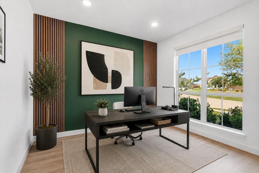 Nestled quietly at the front of the home is the dedicated office. Featuring high ceilings, recessed lighting, bright natural light, and wood look tile floors, this is the ideal space to work from home. *This photo has been virtually staged.