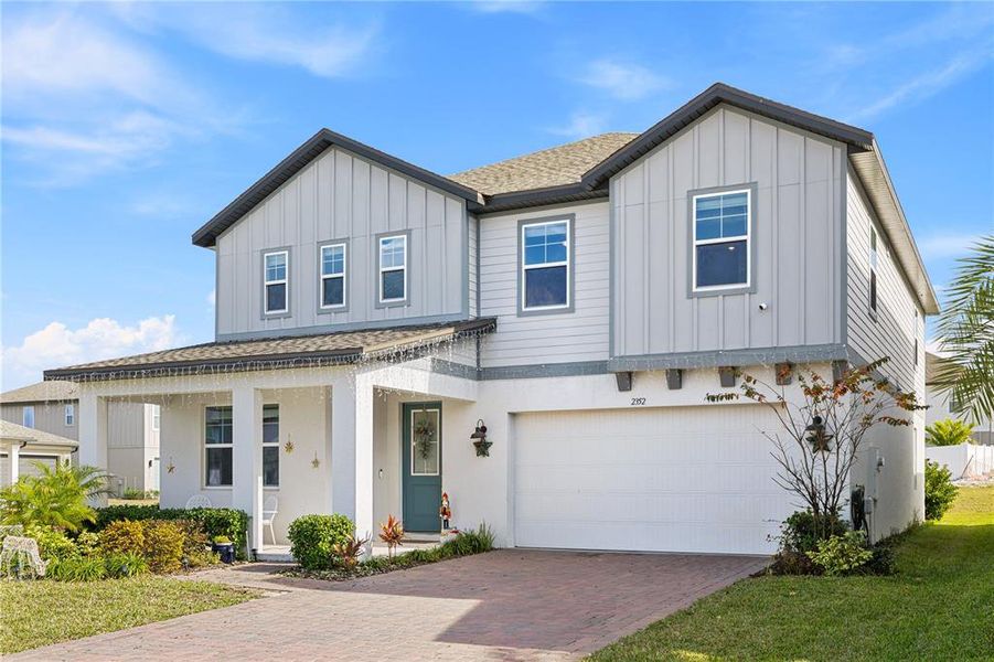Front exterior of a new home in , Minneola, FL, highlighting curb appeal (Image 28).