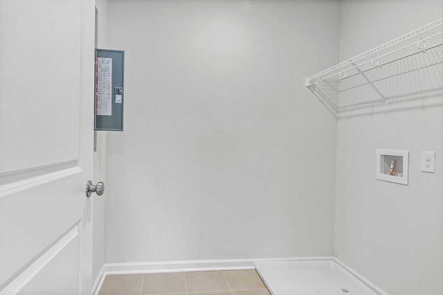 A white bathroom with a white door. A white bathroom with a white door.