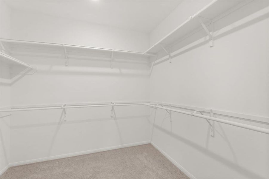 A view of your large primary walk-in Closet