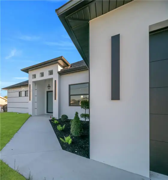 Exterior details and patio area of a home in , Lehigh Acres (Image 4). Exterior details and patio area of a home in , Lehigh Acres (Image 4).