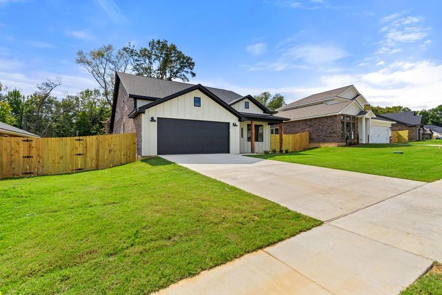 Front exterior of a new home in , Lindale, TX, highlighting curb appeal (Image 20). Front exterior of a new home in , Lindale, TX, highlighting curb appeal (Image 20).