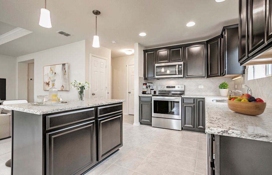 Spacious island kitchen with abundant cabinet space Spacious island kitchen with abundant cabinet space