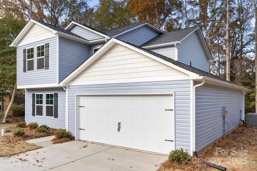 Front exterior of a new home in , Lancaster, SC, highlighting curb appeal (Image 2).