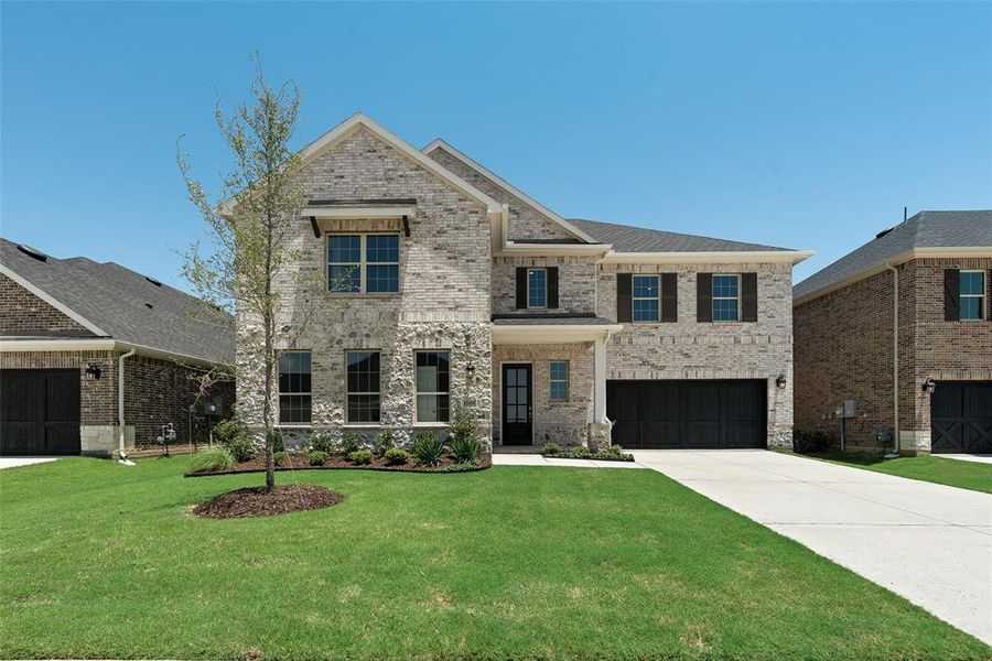 Front exterior of a new home in Valencia On The Lake, Little Elm, TX, highlighting curb appeal (Image 19).