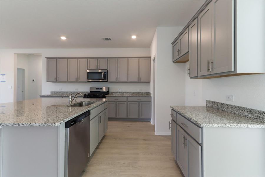 Furnished interior view inside a new home in Bar W Ranch, Leander (Image 4). Furnished interior view inside a new home in Bar W Ranch, Leander (Image 4).