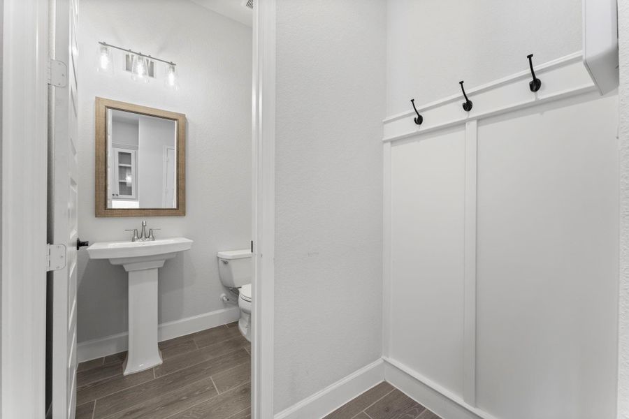 Half bath is near the garage. Mud rack will keep everything (and everyone) organized. Half bath is near the garage. Mud rack will keep everything (and everyone) organized.