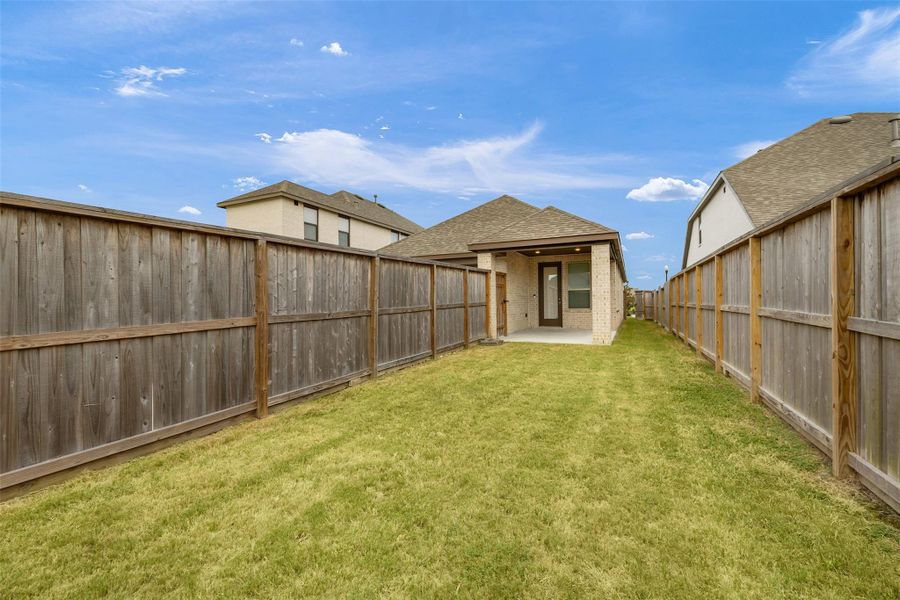 Exterior details and patio area of a home in Riceland, Mont Belvieu (Image 21).