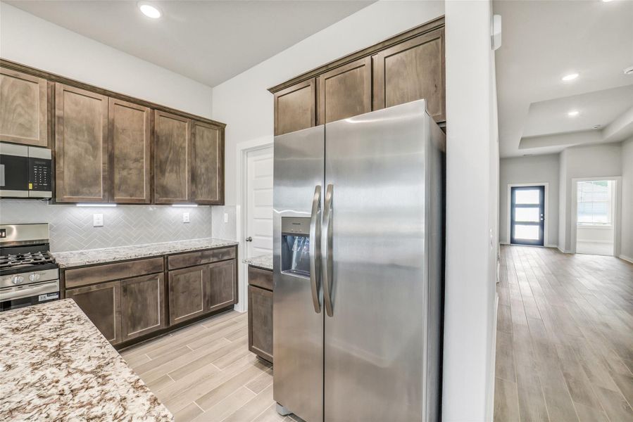 Furnished interior view inside a new home in Windmill Estates, Magnolia (Image 10).
