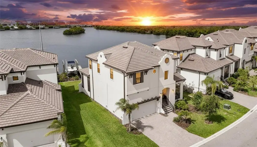 Front exterior of a new home in SouthShore Yacht Club, Ruskin, FL, highlighting curb appeal (Image 2).