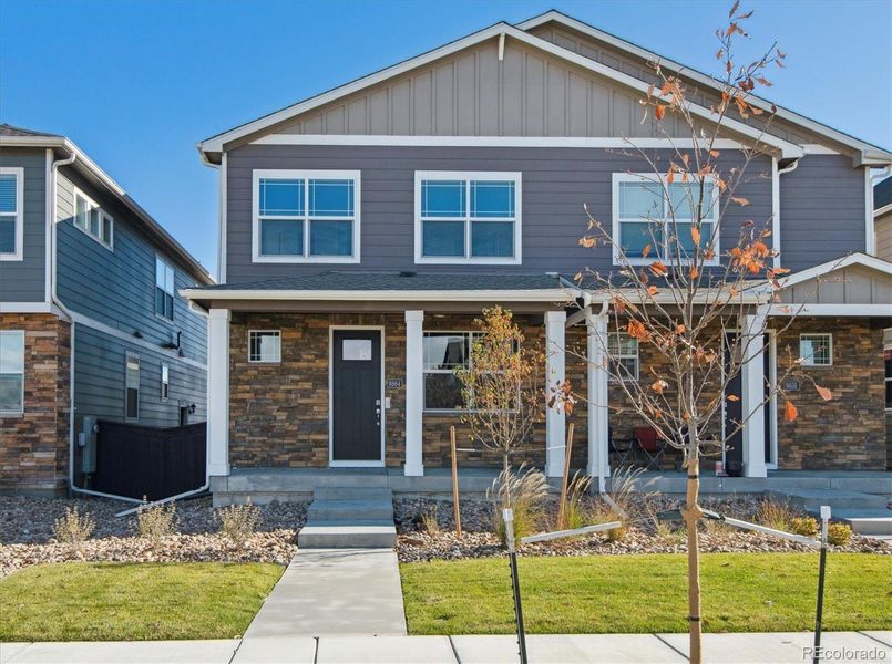 Front exterior of a new home in Settlers Crossing, Commerce City, CO, highlighting curb appeal (Image 2).