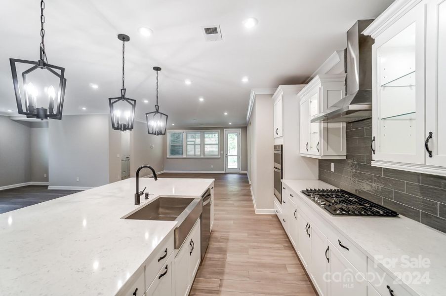 View of Kitchen Island with Sink-(Farmhouse Sink is White in this Home)-Photo similar to Subject Property