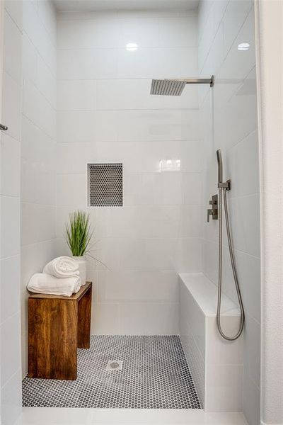 Bathroom with tiled shower and tile patterned floors Bathroom with tiled shower and tile patterned floors