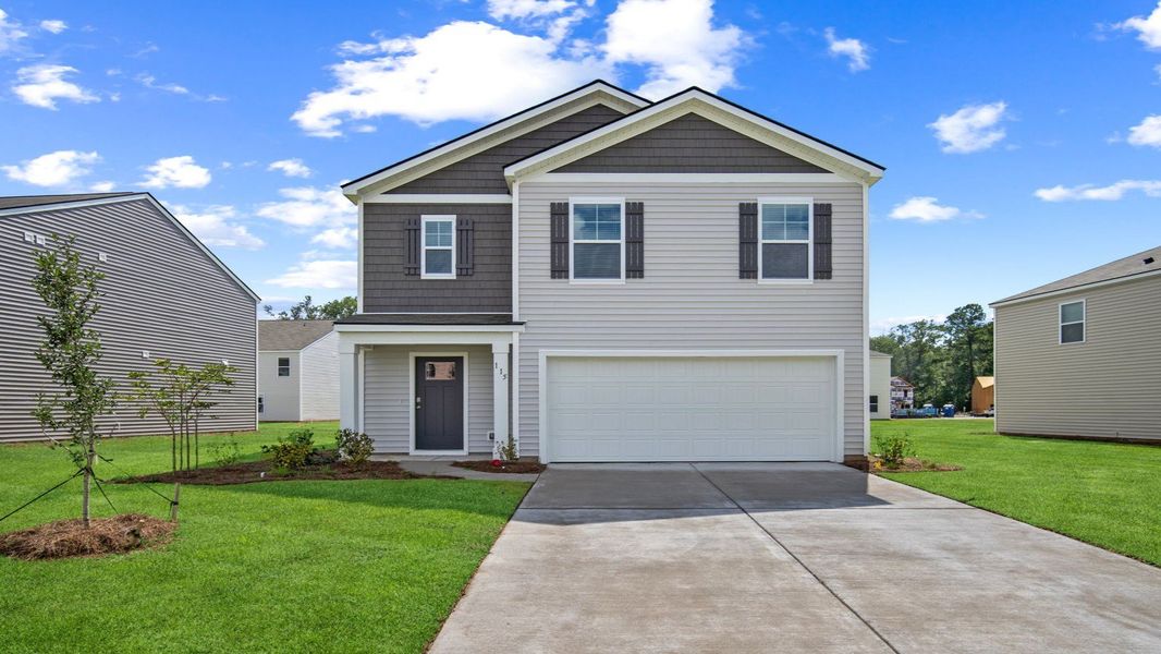 Front exterior of a new home in Cobblestone Village, Savannah, GA, highlighting curb appeal (Image 1). Front exterior of a new home in Cobblestone Village, Savannah, GA, highlighting curb appeal (Image 1).