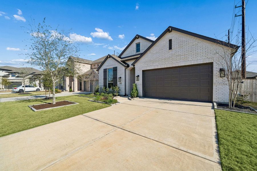 Front exterior of a new home in Fulbrook on Fulshear Creek: 50ft. lots, Fulshear, TX, highlighting curb appeal (Image 1). Front exterior of a new home in Fulbrook on Fulshear Creek: 50ft. lots, Fulshear, TX, highlighting curb appeal (Image 1).