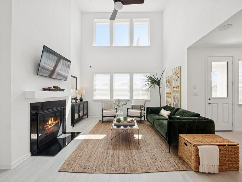 Impressive great room with tons of light and cozy fireplace