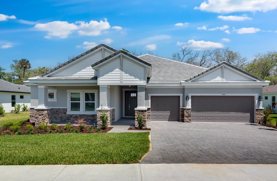 Representative exterior photo of a completed home built from the Sunset by Taylor Morrison in Windchase at Halifax Plantation, Ormond Beach, FL (Image 24).
