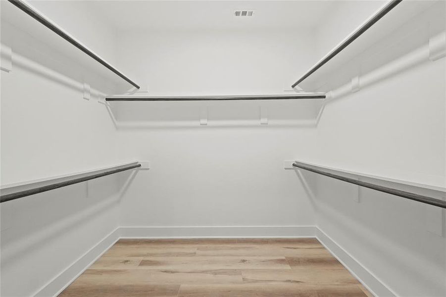 Walk in closet featuring light hardwood / wood-style floors