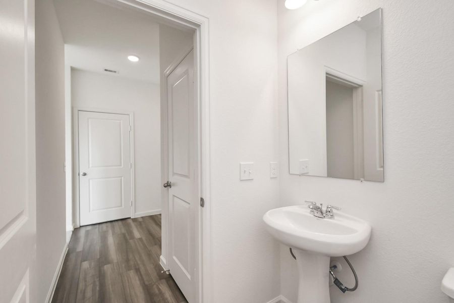 Furnished interior view inside a new home in Sunterra, Katy (Image 10).