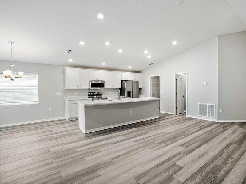 Enjoy a sunny, open living area with volume ceilings - Paisley by Highland Homes