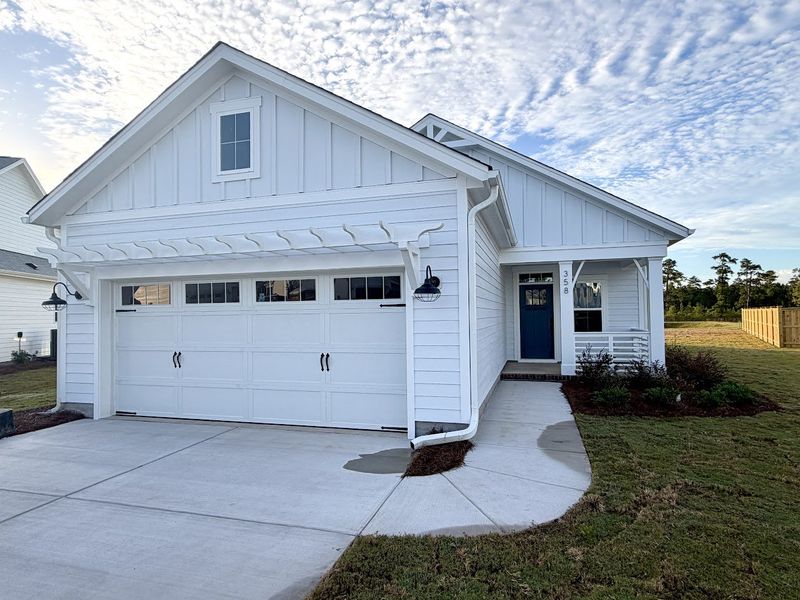 Exterior details and patio area of a home in Songbird, Hampstead (Image 1).