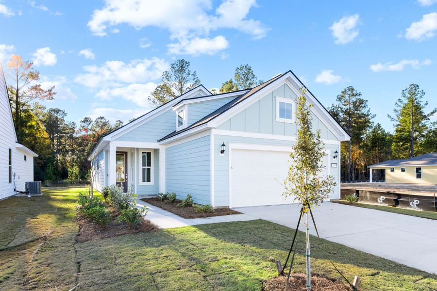 Front exterior of a new home in Sun City Hilton Head, Bluffton, SC, highlighting curb appeal (Image 1). Front exterior of a new home in Sun City Hilton Head, Bluffton, SC, highlighting curb appeal (Image 1).