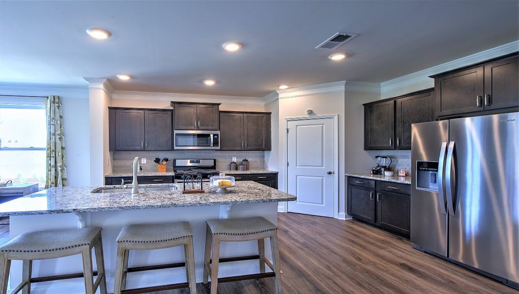 Furnished interior view inside a new home in Reserve at Tap Root Farms, Fletcher (Image 8). Furnished interior view inside a new home in Reserve at Tap Root Farms, Fletcher (Image 8).