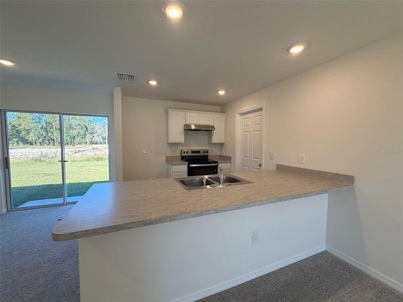 Furnished interior view inside a new home in , Poinciana (Image 4).