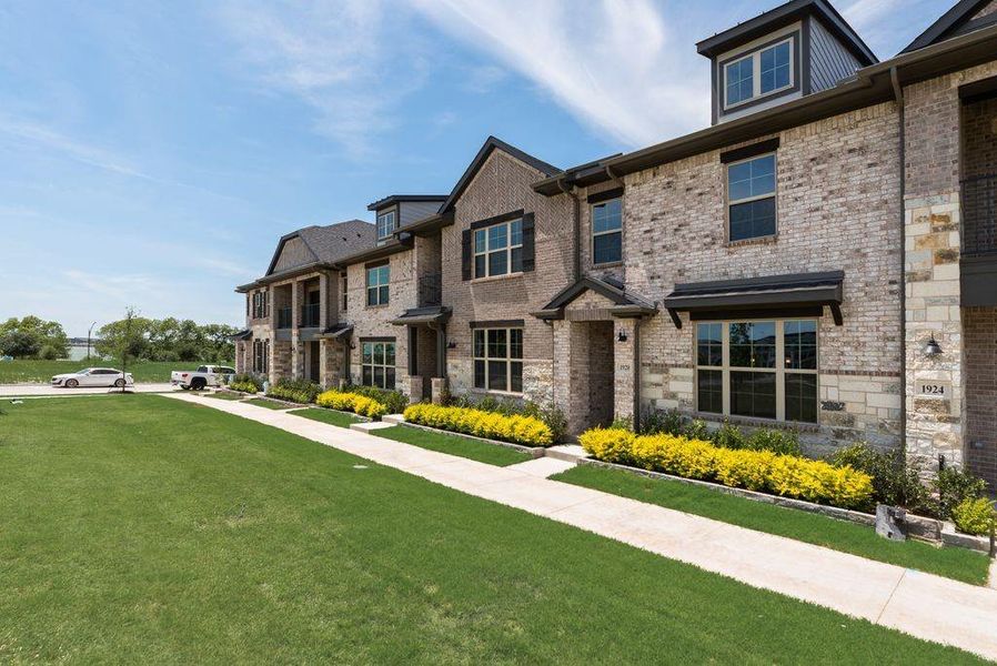 Front exterior of a new home in Bayside, Rowlett, TX, highlighting curb appeal (Image 2). Front exterior of a new home in Bayside, Rowlett, TX, highlighting curb appeal (Image 2).