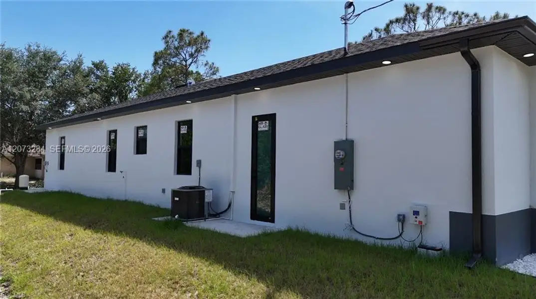 Exterior details and patio area of a home in , Lehigh Acres (Image 4).