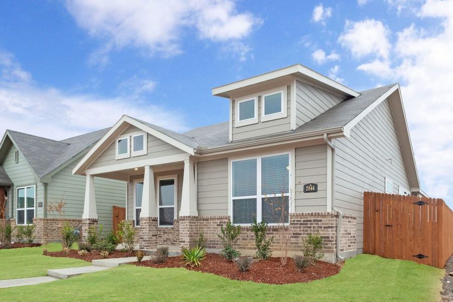 Representative exterior photo of a completed home built from the Joliet by Impression Homes in Heartland, Heartland, TX (Image 2).