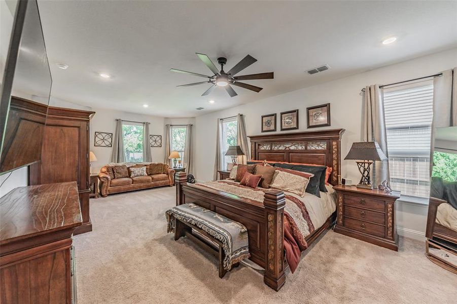 Relaxing primary suite with seating area