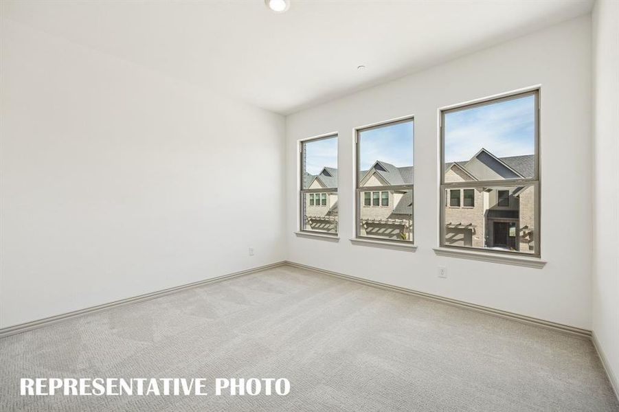 You'll find nicely sized secondary bedrooms in our Walker floor plan.  REPRESENTATIVE PHOTO