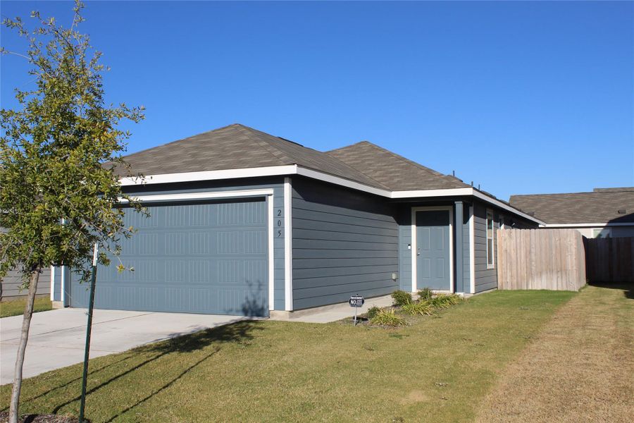 Front exterior of a new home in Cielo Gardens: Belmar Collection, Jarrell, TX, highlighting curb appeal (Image 23).