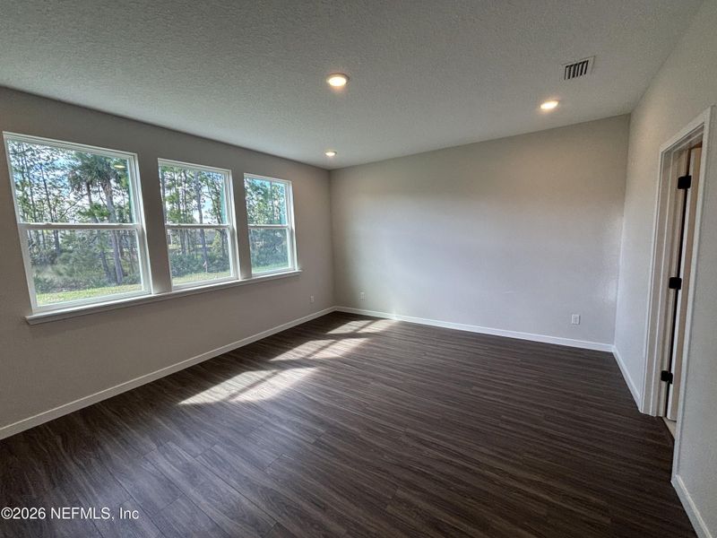 Spacious, unfurnished interior of a new home in The Cypress Series at Reserve East, Flagler Beach (Image 23).