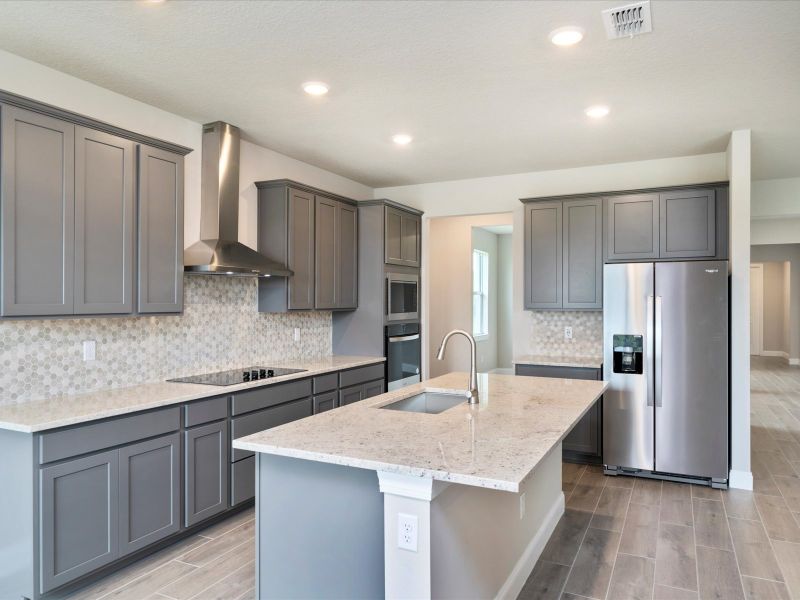 Kitchen in the Onyx floorplan at 6383 NW Sweetwood Drive in Brystol at Wylder