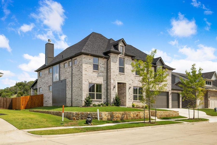 View of property exterior featuring a garage and a yard