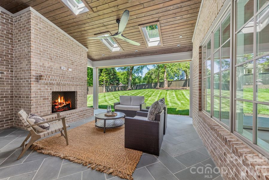 Covered porch with fireplace