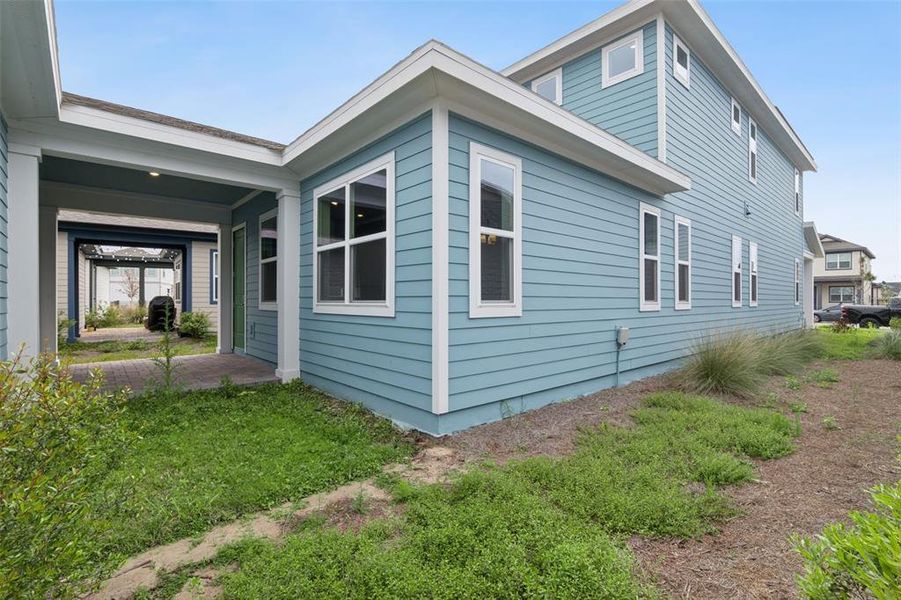Exterior details and patio area of a home in Weslyn Park at Sunbridge, St. Cloud (Image 26).