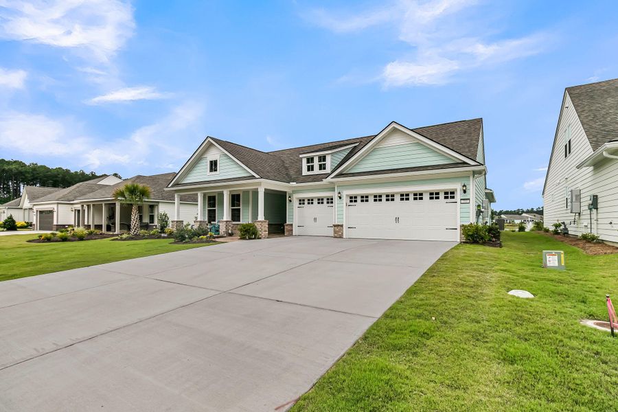 Front exterior of a new home in , Summerville, SC, highlighting curb appeal (Image 26).