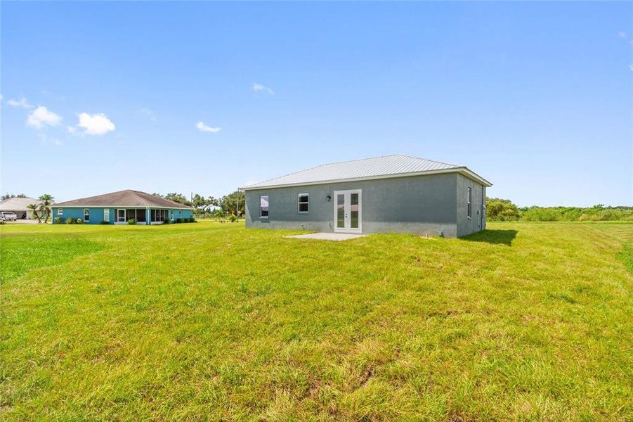 Front exterior of a new home in , Fort Meade, FL, highlighting curb appeal (Image 2).