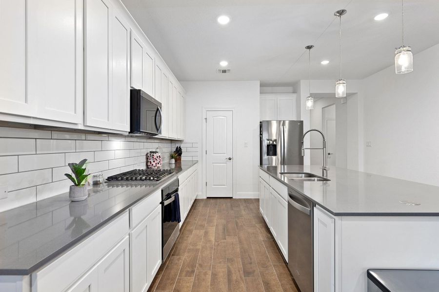 Clean lines and a spacious layout define this modern culinary space.