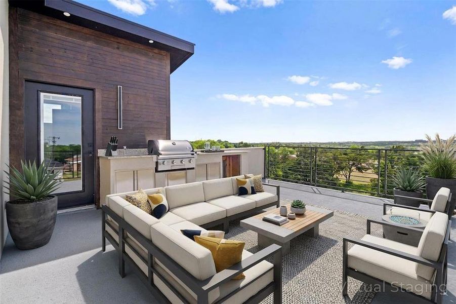 Spacious outdoor patio with an integrated grill and counter space, featuring an expansive view of the surrounding landscape Spacious outdoor patio with an integrated grill and counter space, featuring an expansive view of the surrounding landscape