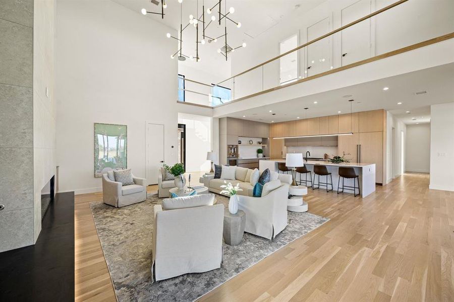 Open-concept living area connecting seamlessly to dining and kitchen spaces. Open-concept living area connecting seamlessly to dining and kitchen spaces.