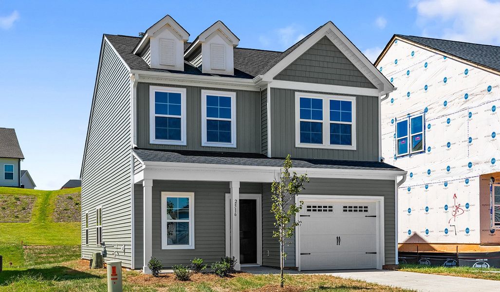 Front exterior of a new home in Hanes Lake, Winston-Salem, NC, highlighting curb appeal (Image 2). Front exterior of a new home in Hanes Lake, Winston-Salem, NC, highlighting curb appeal (Image 2).