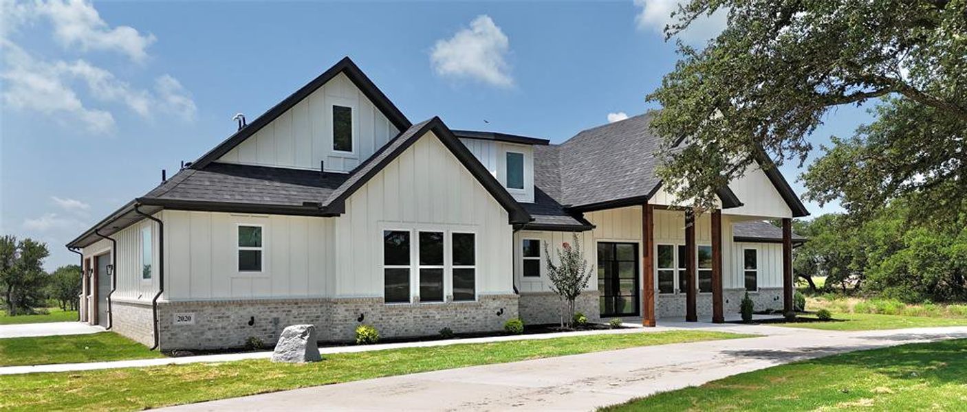 Front exterior of a new home in , Weatherford, TX, highlighting curb appeal (Image 30).
