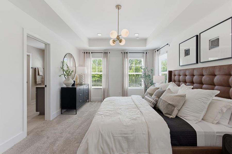 A bedroom with a bed and a couch.